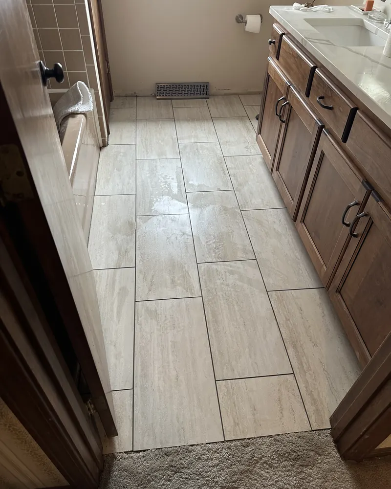 Large-format tile floor in a bathroom