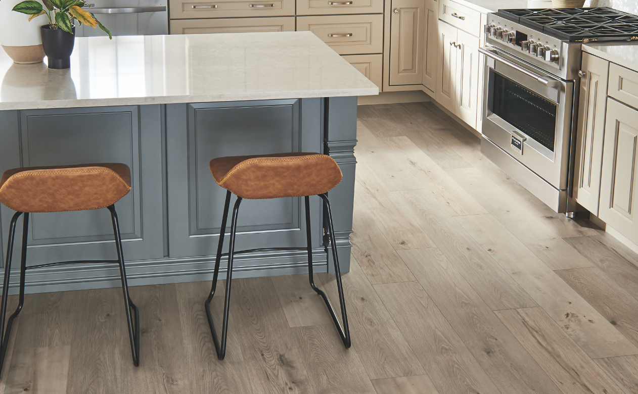 Laminate flooring in kitchen with two barstools