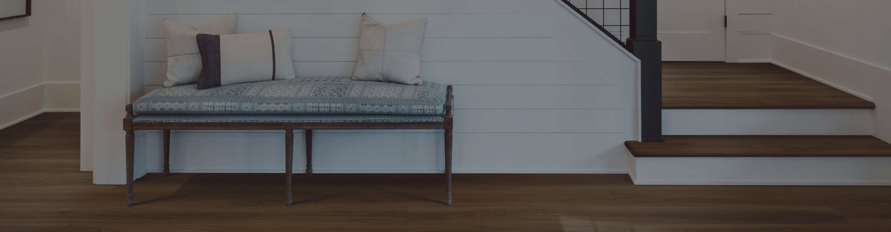 hardwood flooring in entryway with stairs