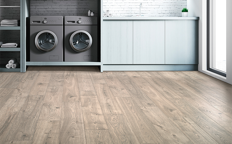 laundry room with light luxury vinyl flooring